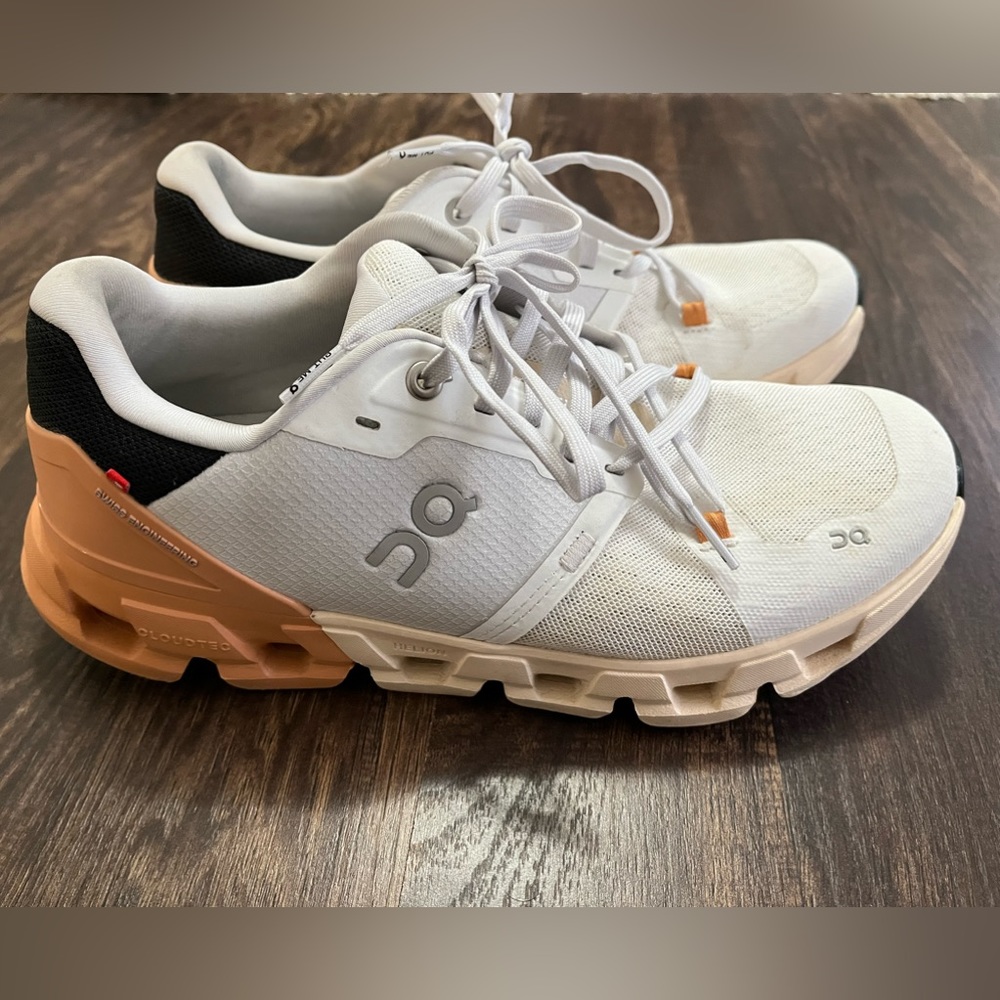 On CloudFlyer 4 running shoes. Size 9 women’s White/copper.